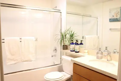 a bathroom with a toilet and a sink and a shower at Santa Monica Place with Free Parking in Los Angeles