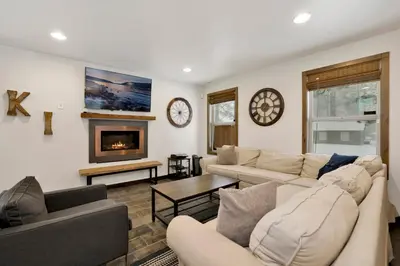 a living room with two couches and a fireplace at Ursa Major Lodge | Walk to Lake & Village | Pet Friendly Retreat in Big Bear Lake
