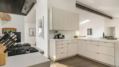 a kitchen with white cabinets and a stove at The Malibu Ranch Retreat by AvanStay Malibu Escape • Valley Views Near Zuma The Ranch Malibu in Malibu