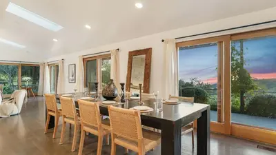 a dining room with a long table and chairs at The Malibu Ranch Retreat by AvanStay Malibu Escape • Valley Views Near Zuma The Ranch Malibu in Malibu