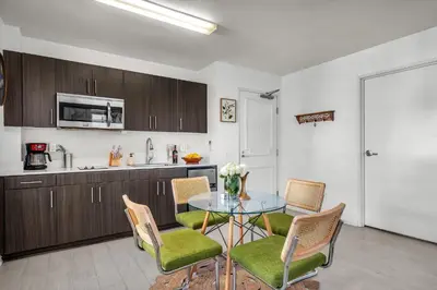 a kitchen and dining room with a table and chairs at Grand Studio On The Promenade Free Parking in Los Angeles