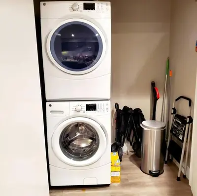 a white washer and dryer in a room at Spacious 2 bed 2 bath, Pool, Hottub, Wifi, 24 hr Fitness, Parking in Los Angeles
