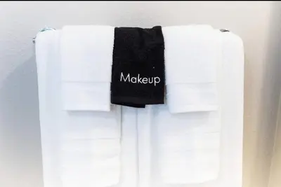 a group of towels hanging on a towel rack at Spacious 2 bed 2 bath, Pool, Hottub, Wifi, 24 hr Fitness, Parking in Los Angeles