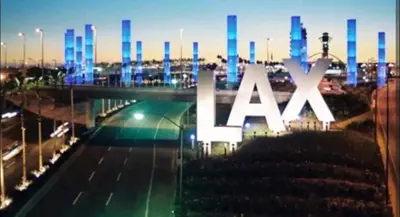 a large x axis sign over a freeway at night at Spacious 2 bed 2 bath, Pool, Hottub, Wifi, 24 hr Fitness, Parking in Los Angeles