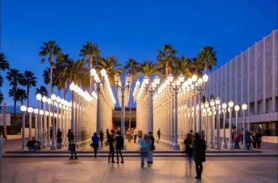 a group of people standing in front of a building with lights at Spacious 2 bed 2 bath, Pool, Hottub, Wifi, 24 hr Fitness, Parking in Los Angeles