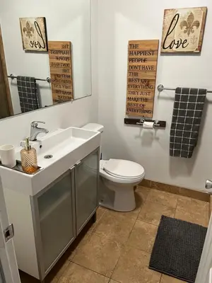 a bathroom with a sink and a toilet and a mirror at Charming 1 bedroom apt in Beverly Hills in Los Angeles