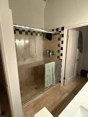 a bathroom with a shower with a glass door at Venice beach in Los Angeles