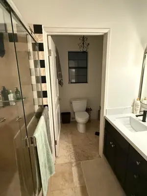 a bathroom with a toilet and a sink at Venice beach in Los Angeles