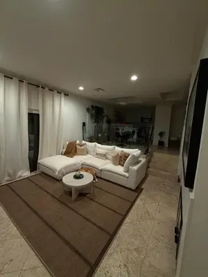 a living room with a white couch and a table at Venice beach in Los Angeles
