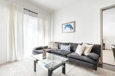 a living room with a couch and a glass table at Brilliant 2BD condo in Los Angeles