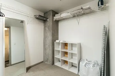 a dressing room with a mirror and a shelf at Brilliant 2BD condo in Los Angeles
