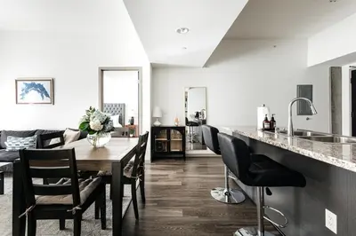 a kitchen and dining room with a table and chairs at Brilliant 2BD condo in Los Angeles