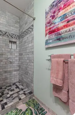a bathroom with a shower with pink towels at Zen guess house in Los Angeles