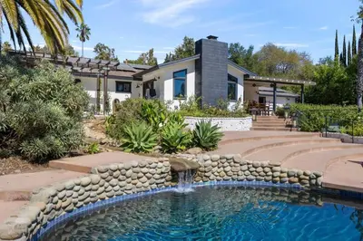 a home with a swimming pool and a house at Private Estate with Cottage, Pool & Tennis in Ojai