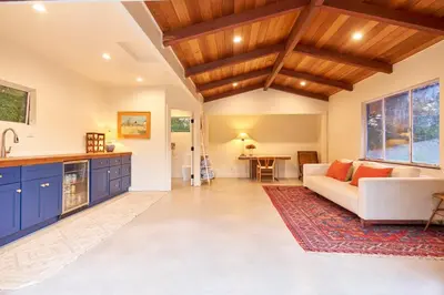 a living room with a couch and a table at Rancho Palomar in Ojai
