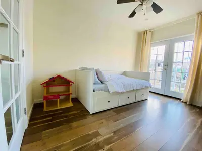 a bedroom with a bed and a table in it at Beach House in Los Angeles