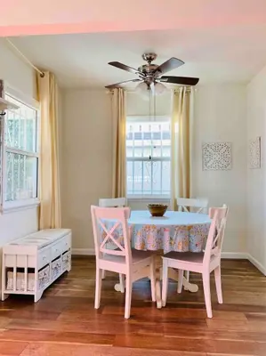 a dining room with a pink table and chairs at Beach House in Los Angeles