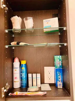 a wooden cabinet with some items in it at Beach House in Los Angeles