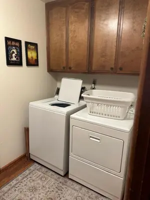 a kitchen with a white refrigerator and a washing machine at Le Studio de Sud in Lake Arrowhead