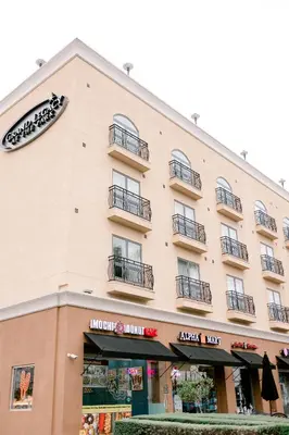 a large building with balconies on the side of it at Grand Legacy At The Park in Anaheim