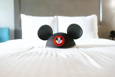 a teddy bear hat is sitting on a bed at Grand Legacy At The Park in Anaheim