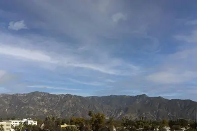a view of a mountain range with buildings and trees at Residence Inn by Marriott Los Angeles Pasadena/Old Town in Pasadena