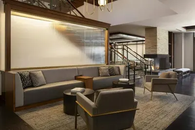 a lobby with a couch and chairs and a staircase at Residence Inn by Marriott Los Angeles Pasadena/Old Town in Pasadena