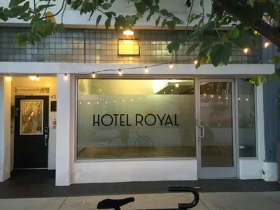 a hotel royal sign in the window of a store at Hotel Royal in Long Beach