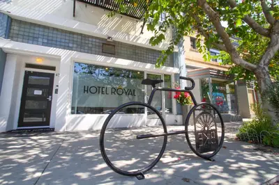 a bike is parked in front of a store at Hotel Royal in Long Beach