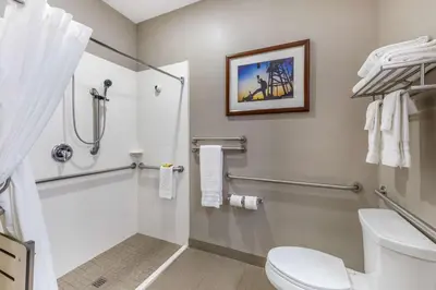 a bathroom with a toilet and a shower at Best Western Plus Taft Inn in Taft