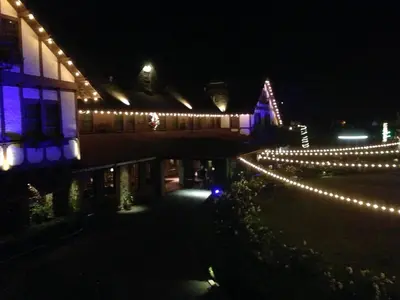 a building decorated with christmas lights at night at Glen Tavern Inn in Santa Paula