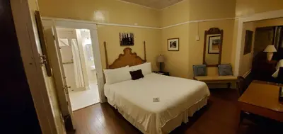 a bedroom with a large bed in a room at Glen Tavern Inn in Santa Paula