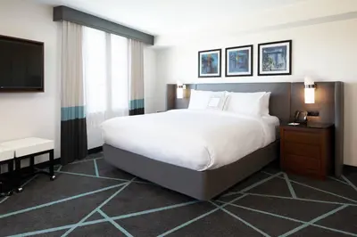 a bedroom with a large bed and a television at Fairfield Inn & Suites By Marriott Camarillo in Camarillo