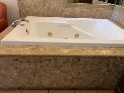 a bath tub with a sink in a bathroom at Chantico Inn in Ojai