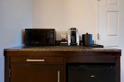 a microwave and coffee maker on a counter in a room at Hilton Garden Inn San Bernardino in San Bernardino