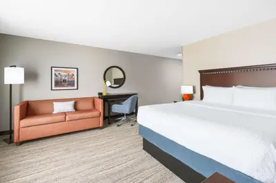 a hotel room with a bed and a couch at Hampton Inn & Suites Thousand Oaks in Thousand Oaks
