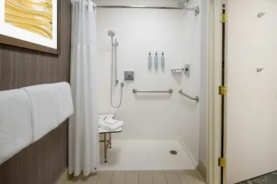a bathroom with a shower with a shower curtain at Courtyard by Marriott Palmdale in Palmdale