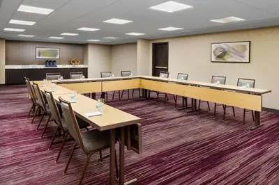 a large conference room with tables and chairs at Courtyard by Marriott Palmdale in Palmdale