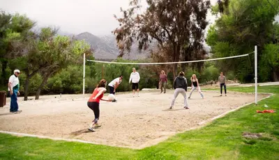 a group of people playing a game of volleyball at Soledad Canyon Cottage 2 in Ravenna