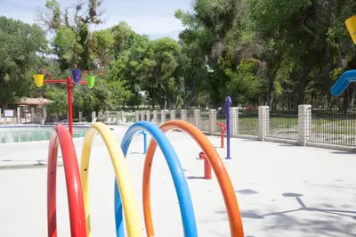 a row of colorful playground equipment in a park at Soledad Canyon Cottage 5 in Ravenna