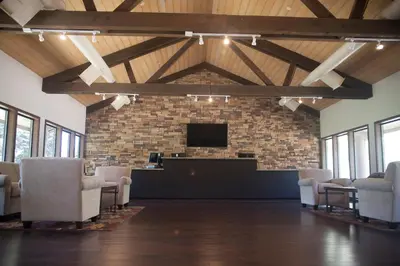 a waiting room with chairs and a flat screen tv at Soledad Canyon Studio Cabin 19 in Ravenna