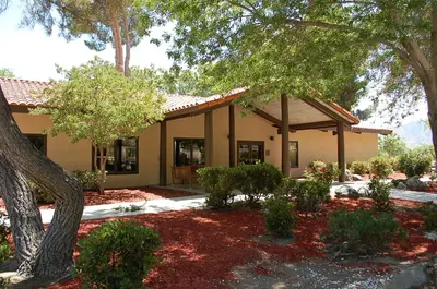 a house with a tree in front of it at Soledad Canyon Studio Cabin 21 in Ravenna