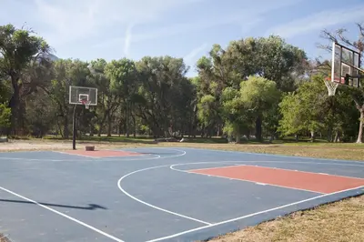 a basketball court with a hoop in a park at Soledad Canyon Deluxe Cabin 23 in Ravenna