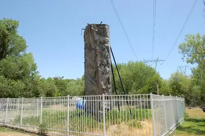 a climbing ape in a playground behind a fence at Soledad Canyon Deluxe Cabin 23 in Ravenna