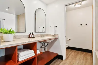 a bathroom with a sink and a mirror at Hotel Casa 425 + Lounge, A Four Sisters Inn in Claremont