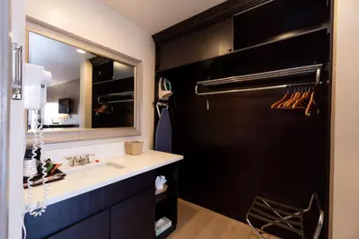 a bathroom with a sink and a mirror at Super 8 by Wyndham Anaheim/Disneyland Drive in Anaheim