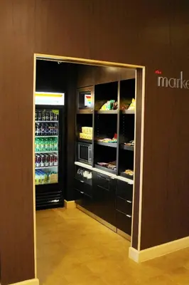 a room with an open refrigerator in a store at Courtyard by Marriott Baldwin Park in Baldwin Park