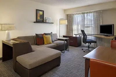 a living room with a couch and a desk with a computer at Residence Inn Anaheim Hills Yorba Linda in Anaheim