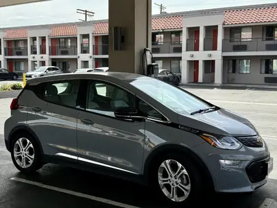 a silver car parked in a parking lot at The Hills Inn Eagle Rock - Near Old Town Pasadena in Los Angeles