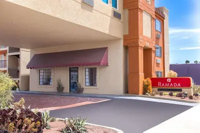 a hotel with a sign in front of a building at Ramada by Wyndham Culver City in Los Angeles